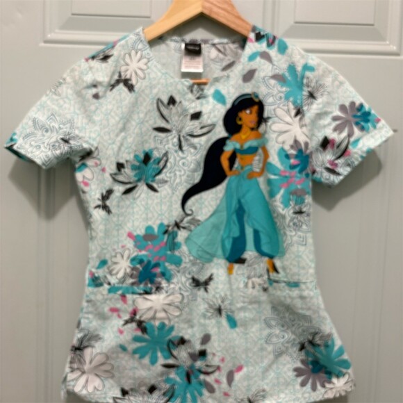 Disney Tops - Disney  Scrub Top Womens 2XS Disney Jasmine Aladdin Floral